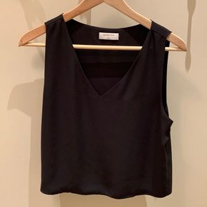 Black sleeveless blouse by Babaton
